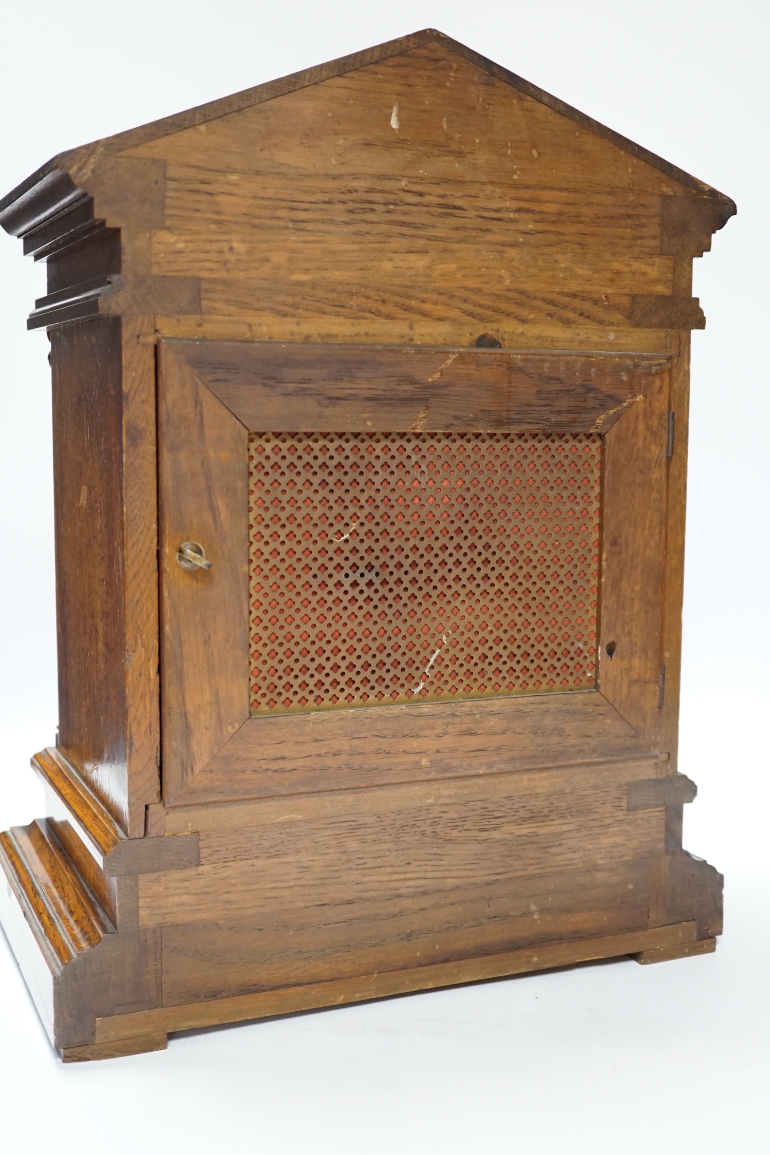 Victorian oak mantel clock, brass dial and mask spandrels; Winterhalder & Hoftmier two train movement, quarter striking in an architectural case, 39cm. (Provenance Phillips Chester 7/05/93), 40cm high